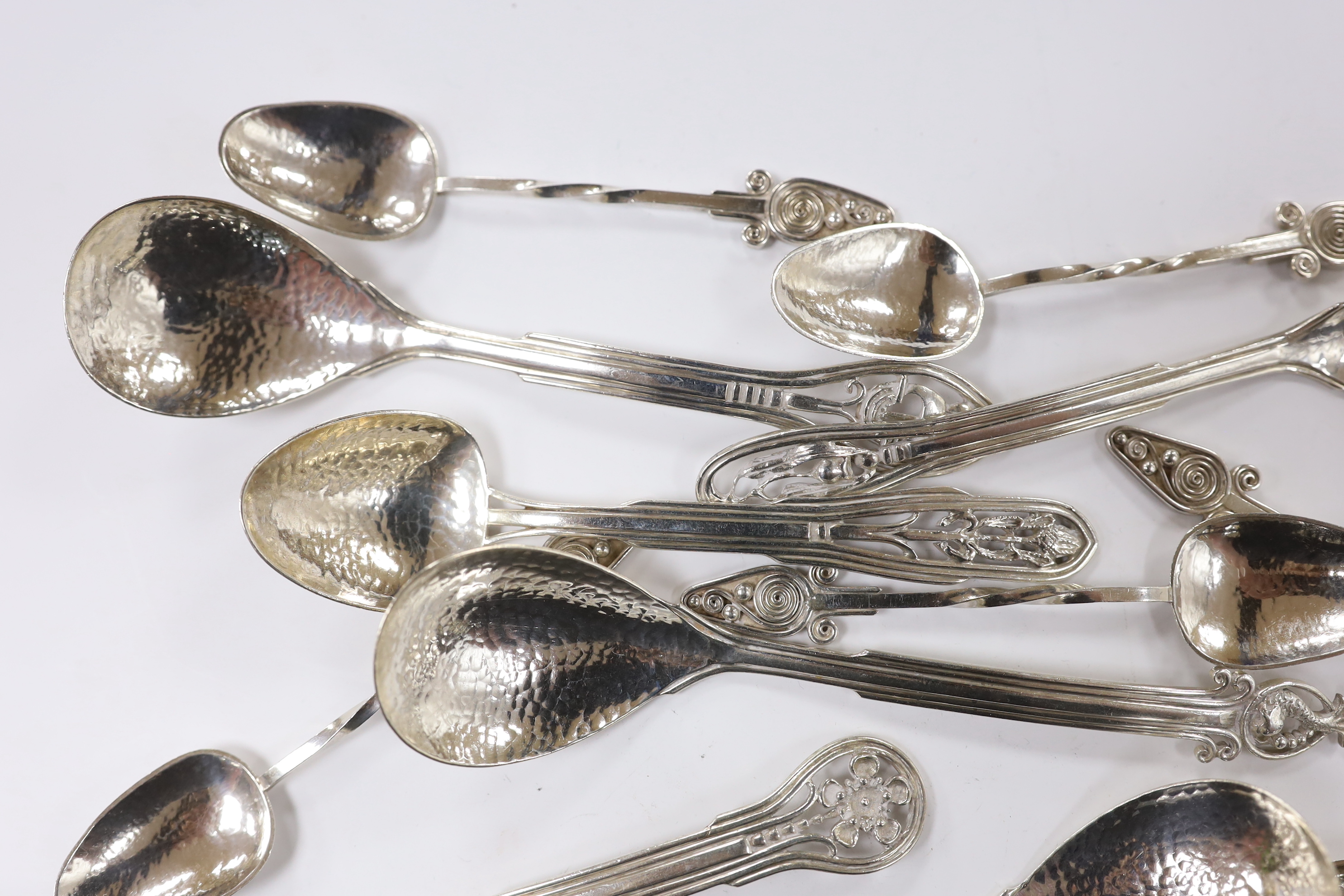 Seven Australian Arts & Crafts sterling spoons, by James A. Linton, with planished bowls and differing terminals, largest 15.2cm, together with a set of six Australian Arts & Crafts sterling small spoons, one with maker'